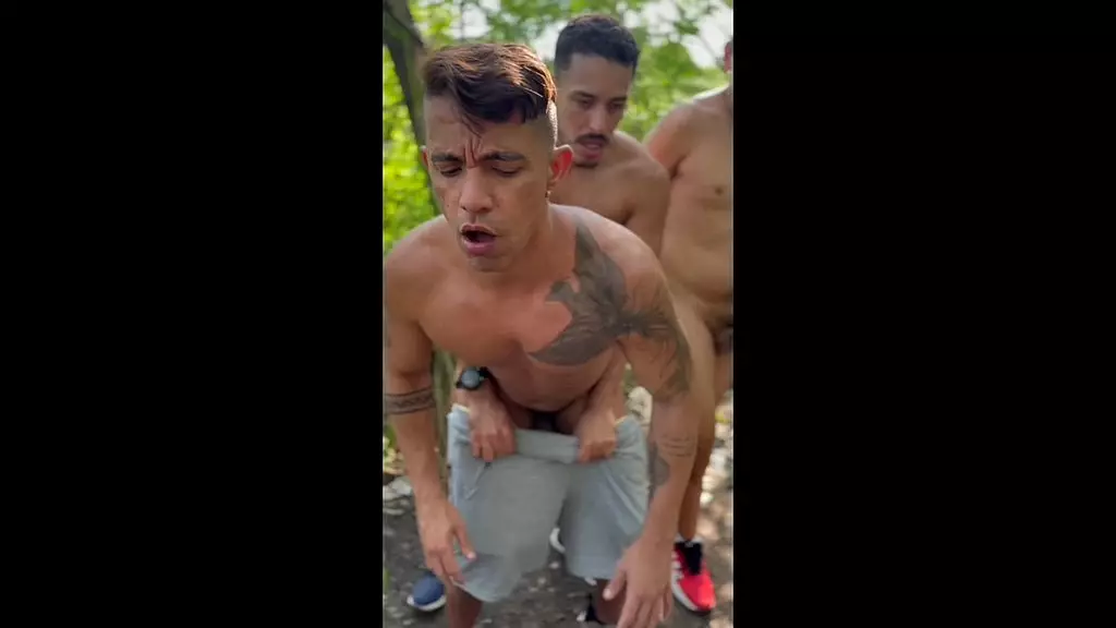 men giving ass in the park