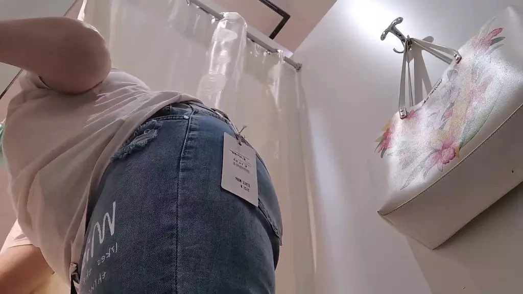 fat italian milf tries on jeans in shop wearing butt plug