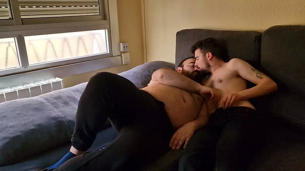 chubby young man and hairy bear fuck bareback on the couch