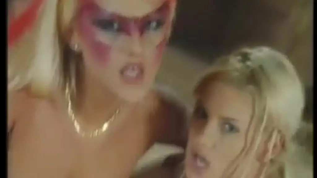 two stunning blondes in crazy makeup share a huge cock